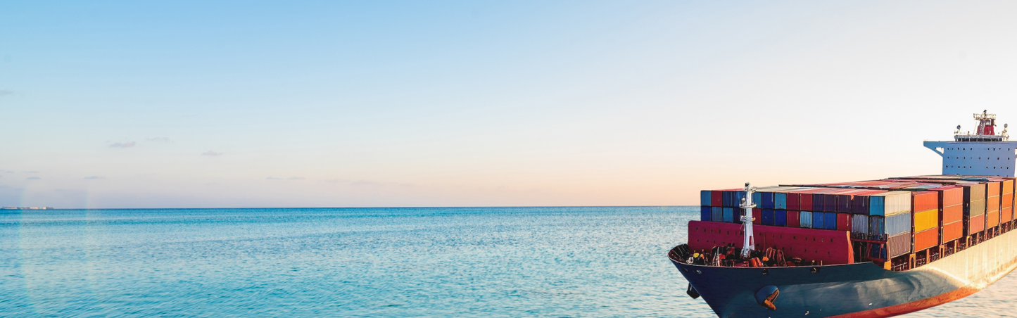 Container ship on the ocean with a clear sky