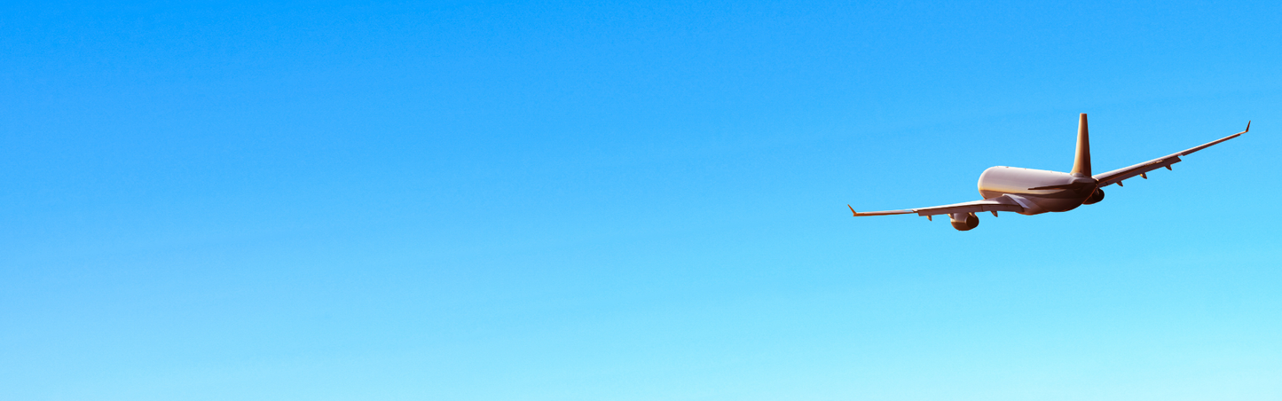 Airplane flying in a clear blue sky